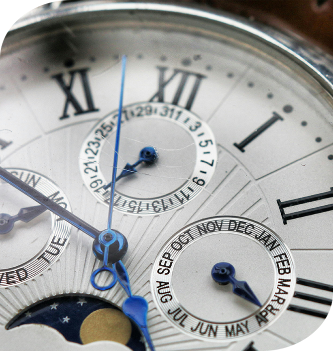 A close up of the face of an analog watch