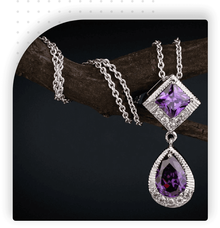 A necklace with a purple stone hanging from it.