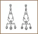 A pair of earrings with dangling drops and diamond accents.