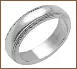 A silver ring with two lines on it's side.