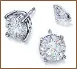 A set of three diamond earrings and one diamond pendant.