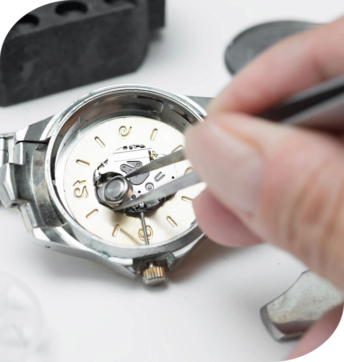 A person is working on a watch